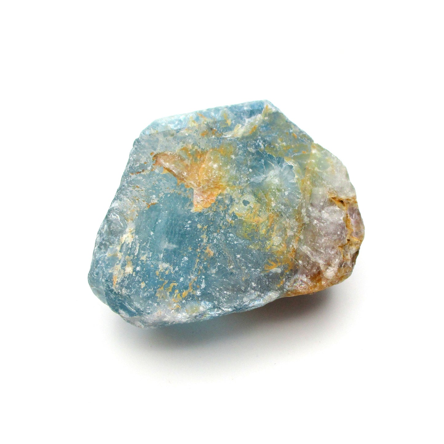A Blue Fluorite crystal with natural mineral imperfections on a white background