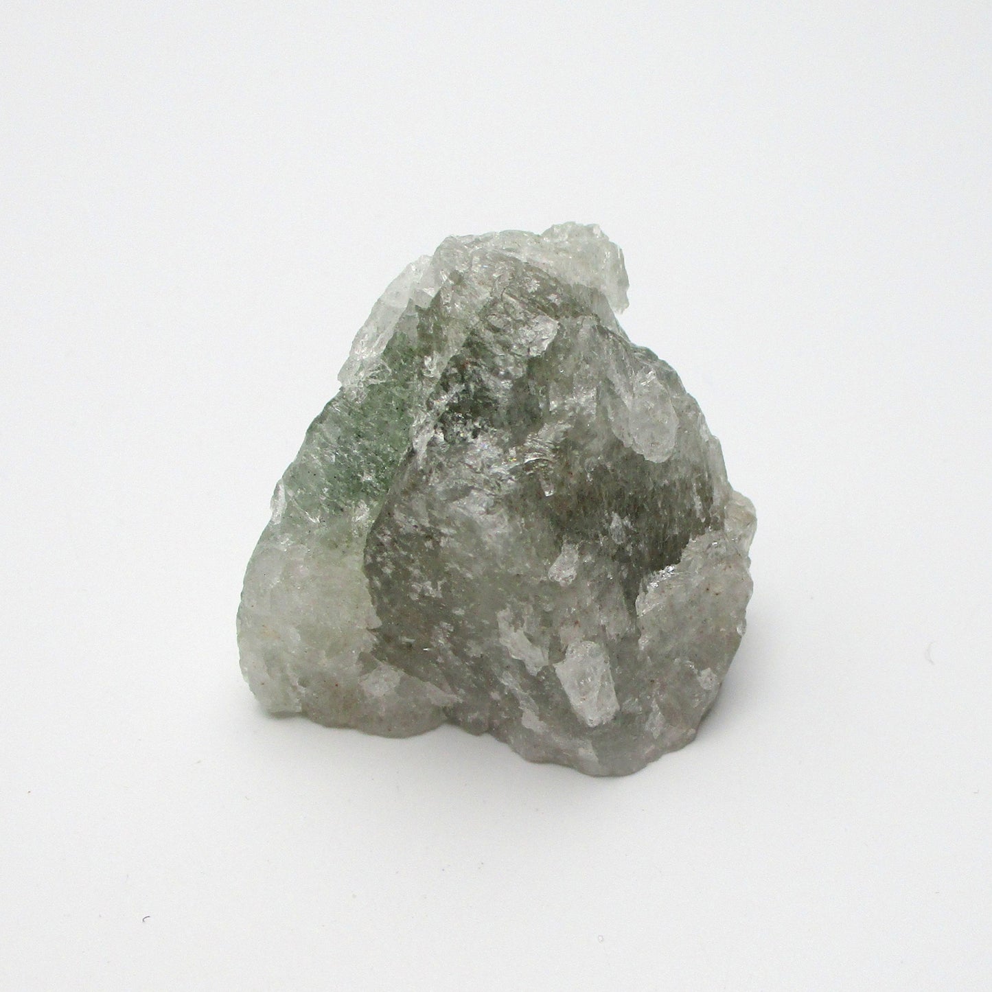 A rough, uncut Aquamarine crystal with a translucent greenish appearance, displayed on a white background.