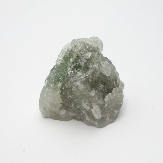 A rough, uncut Aquamarine crystal with a translucent greenish appearance, displayed on a white background.