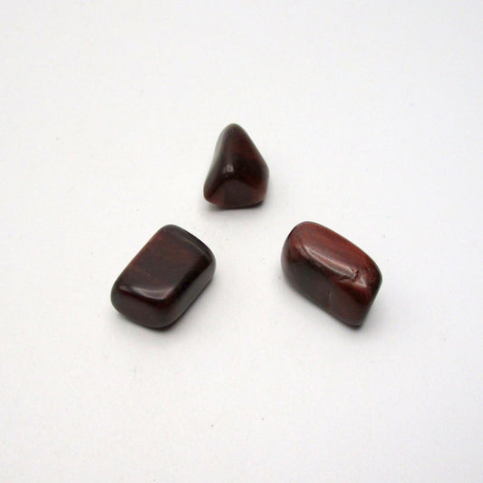 Set of three red tigers eye on white background