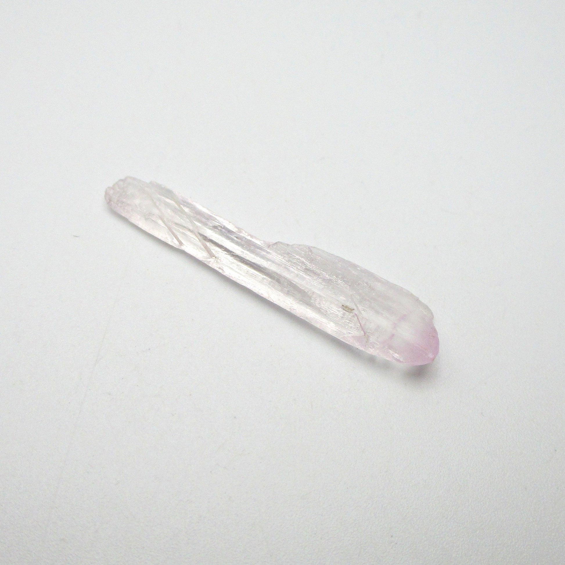 kunzite crystal on white background