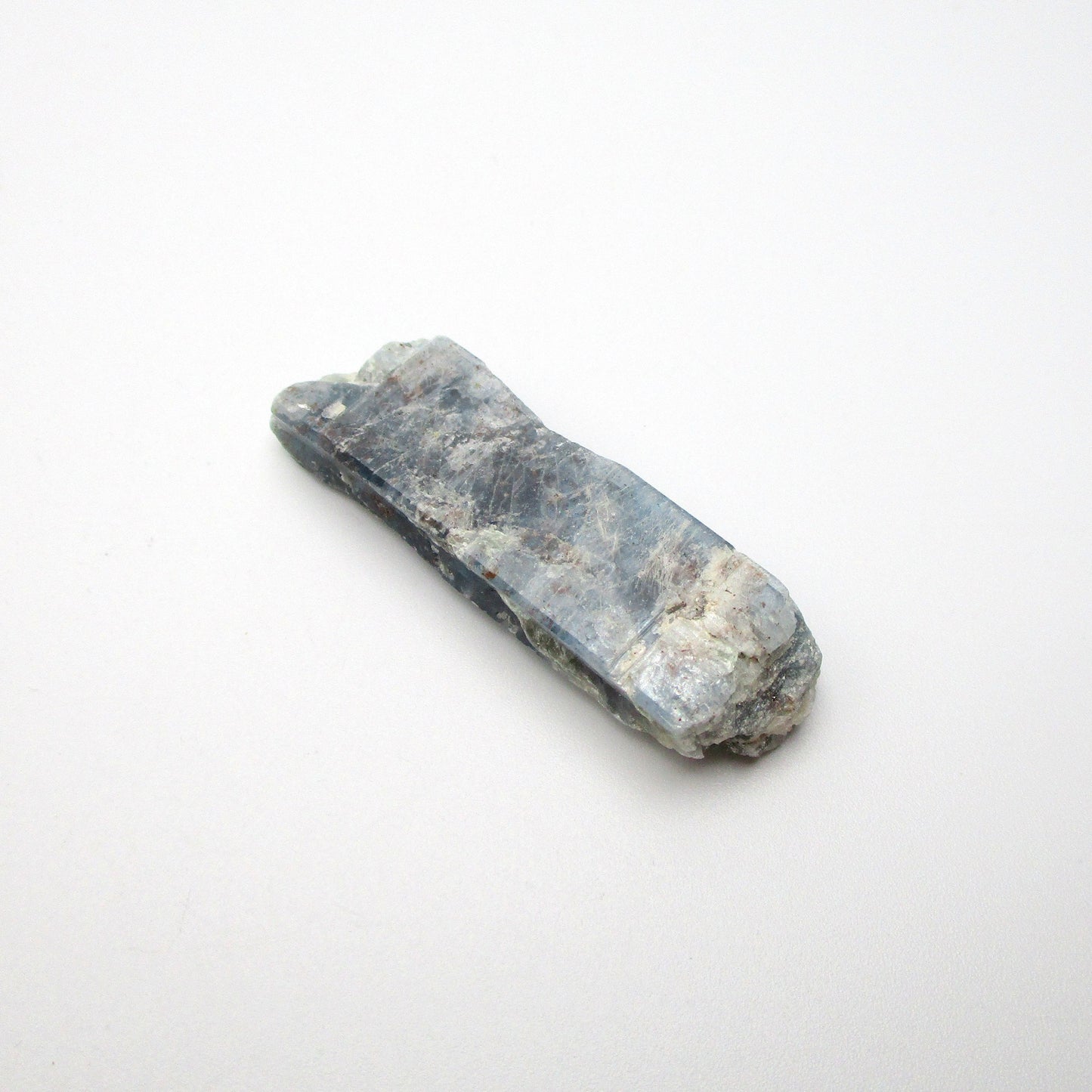 Tri-color kyanite from Brazil on a white background