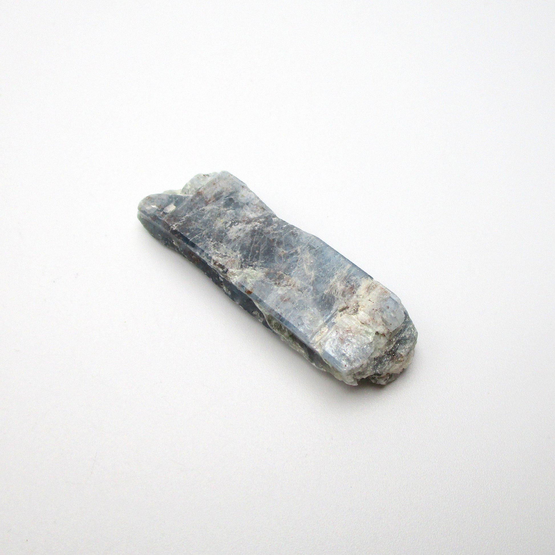 Tri-color kyanite from Brazil on a white background