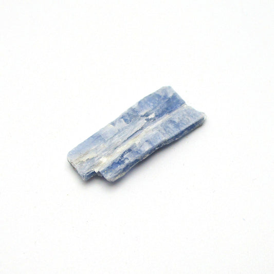 A small piece of Brazilian blue kyanite crystal, displayed on a white background.