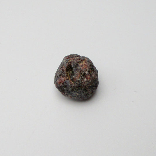 Almandine garnet on a white background