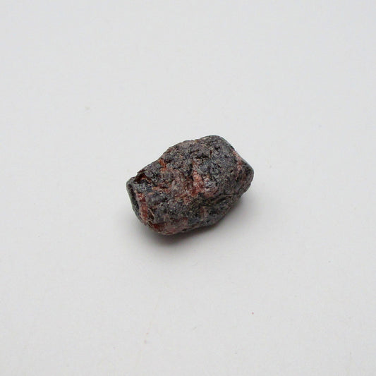Almandine garnet on a white background