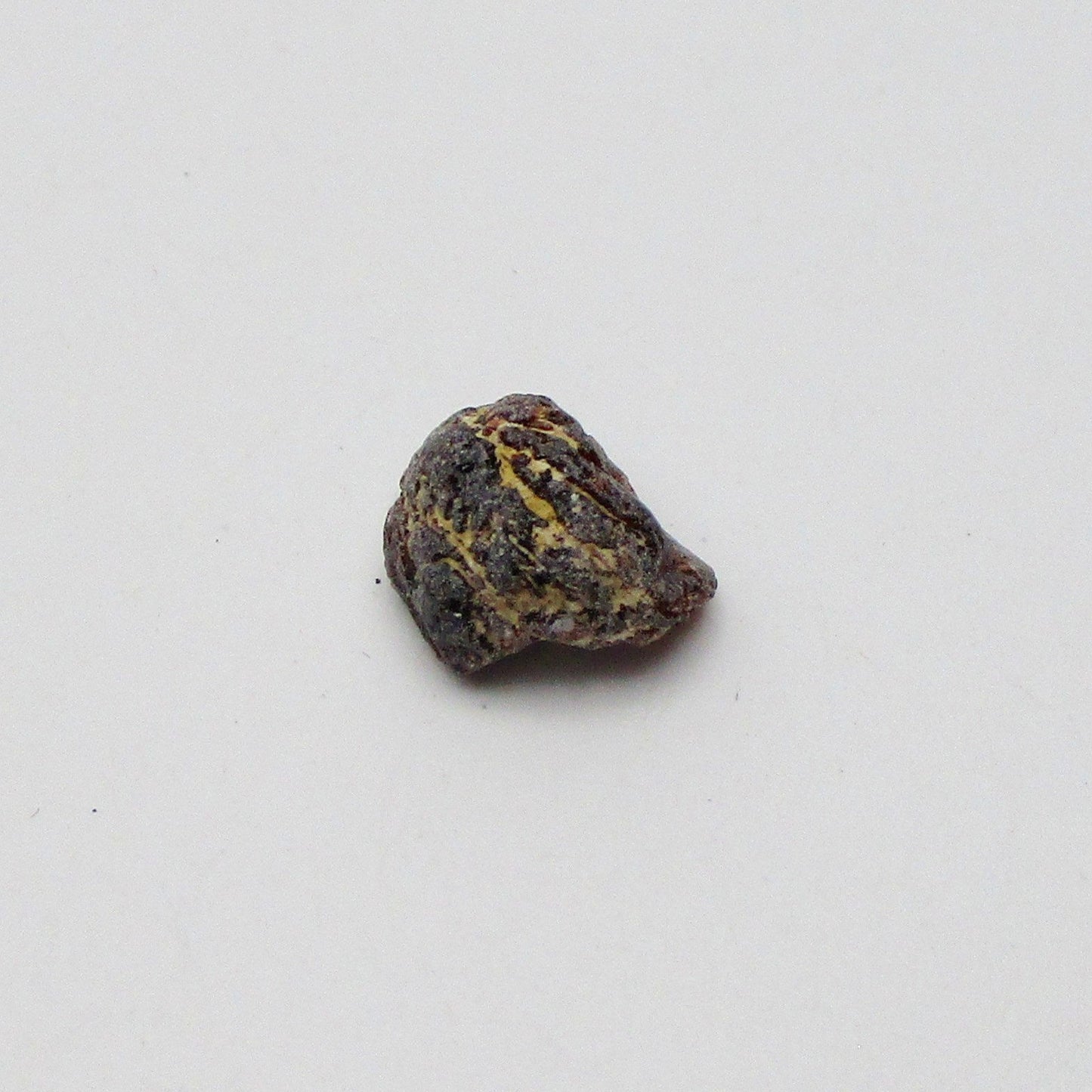Almandine garnet on a white background