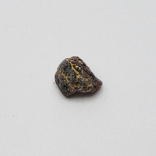 Almandine garnet on a white background
