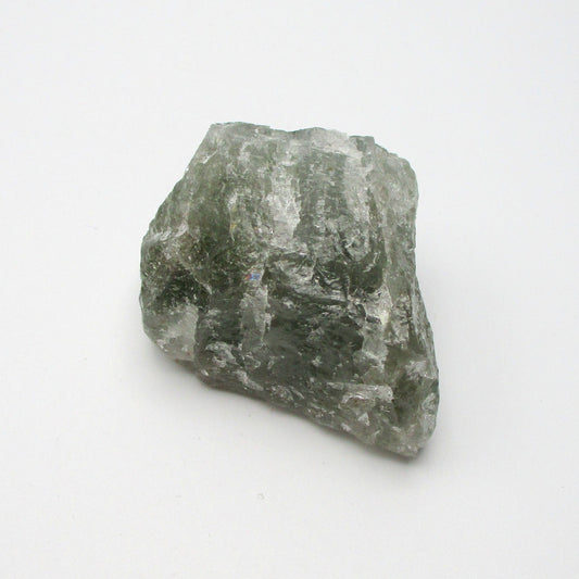 A rough Aquamarine crystal with a greenish tint against a white background.