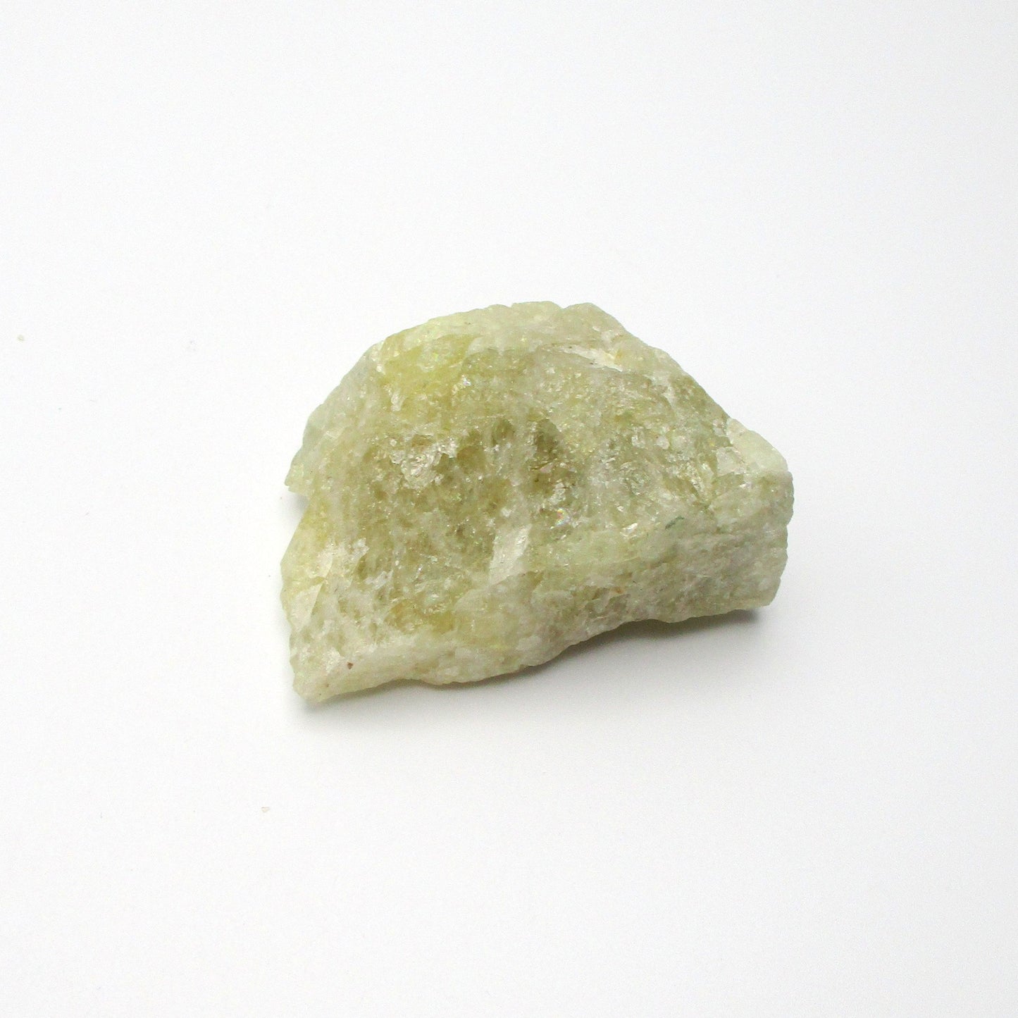 A rough Aquamarine crystal on a white background
