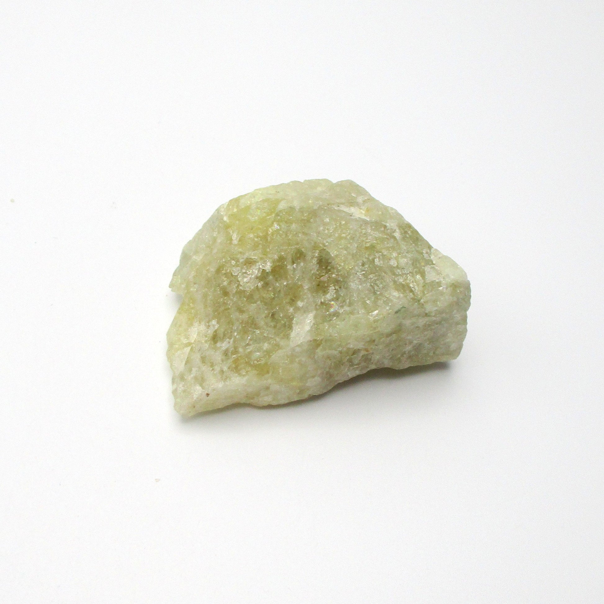 A rough Aquamarine crystal on a white background