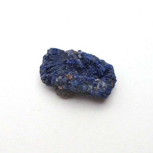 Blue mineral sample on a white background