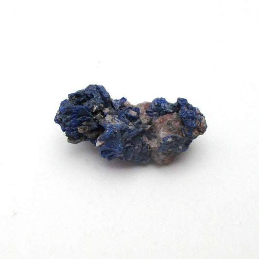 Blue mineral sample on a white background