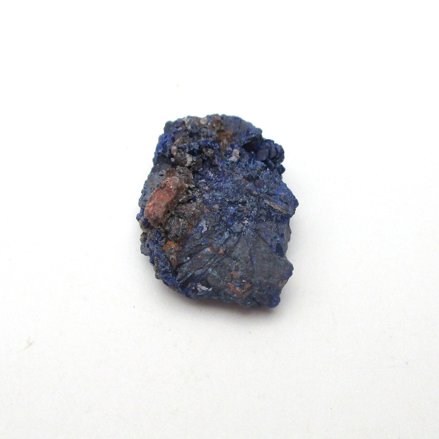 small blue azurite crystal on a white background