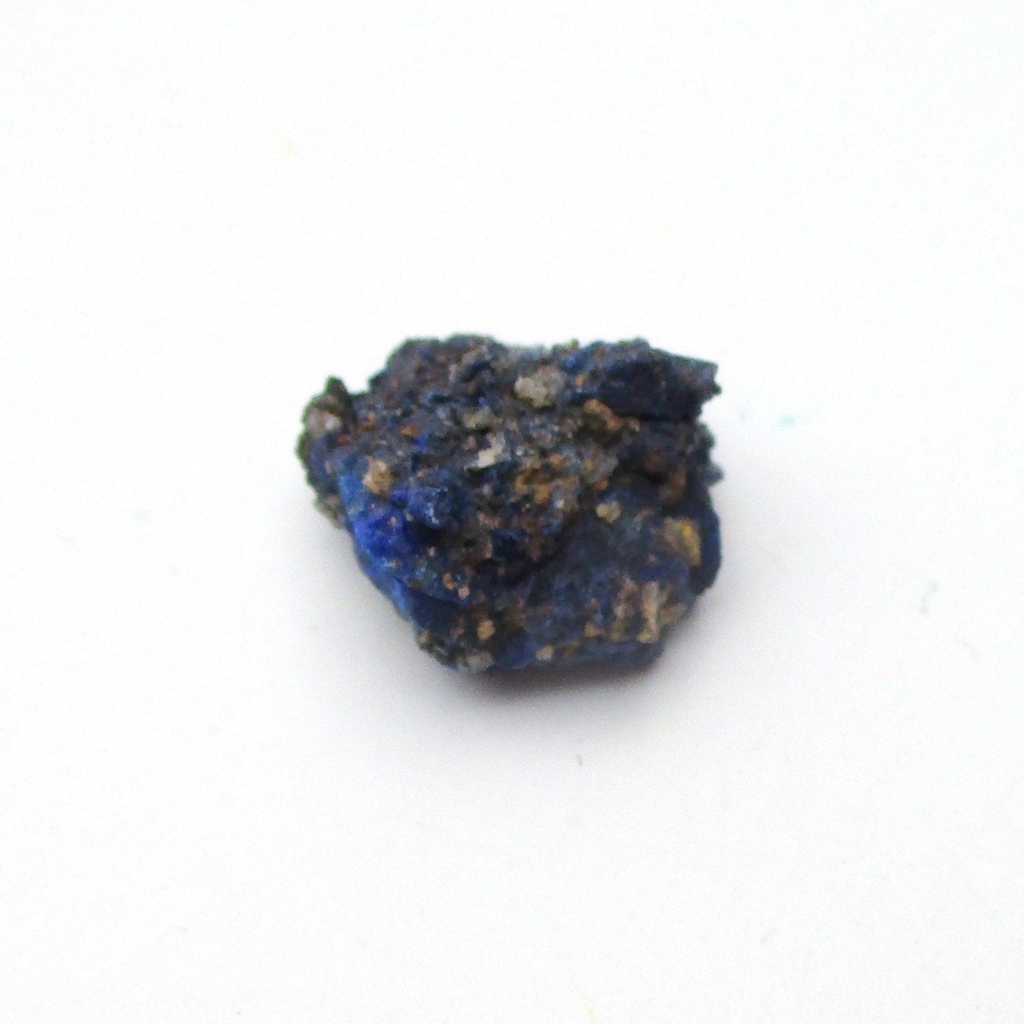 small blue azurite crystal on a white background
