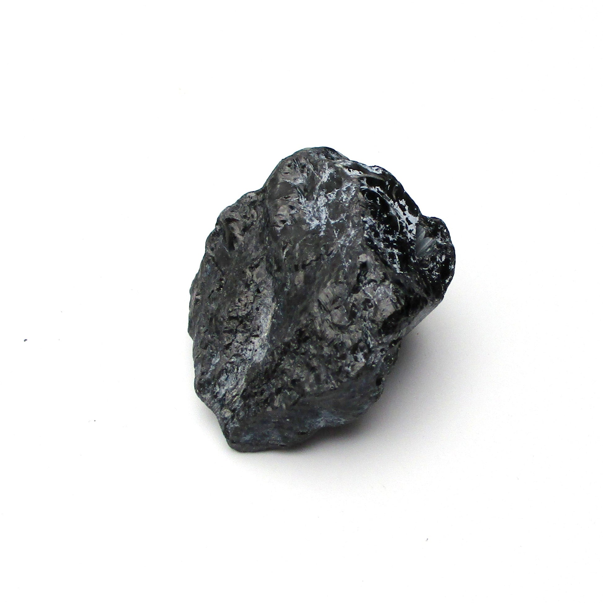 A rough, black tourmaline crystal with a metallic sheen, approximately 1 inch in size, displayed on a white background.