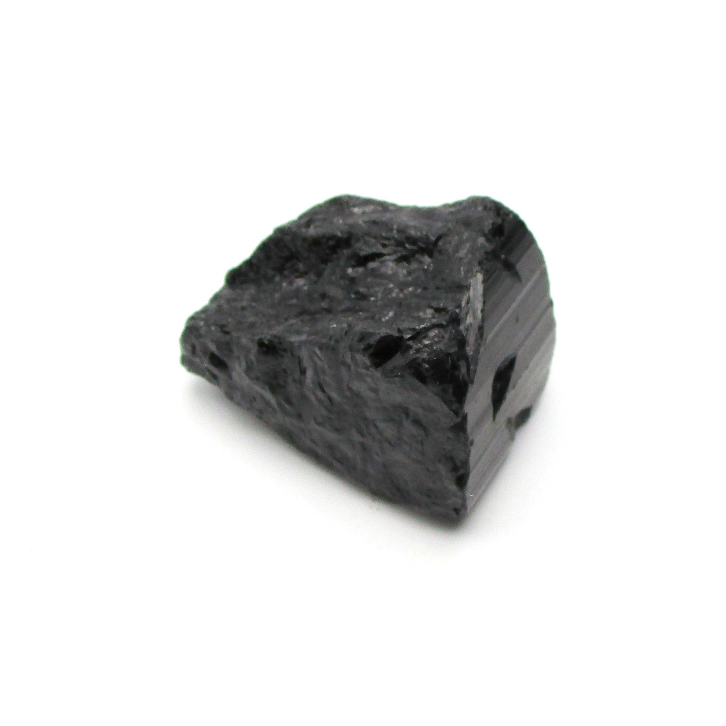 A rough, black tourmaline crystal with a metallic sheen, approximately 1 inch in size, displayed on a white background.