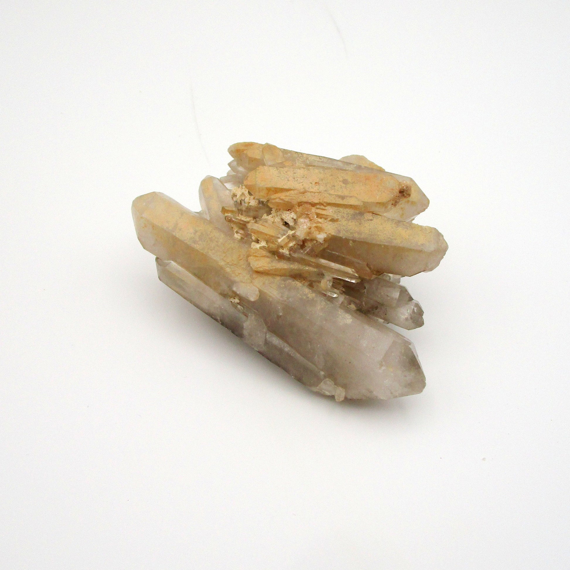 A photograph of a Russian Quartz Point crystal against a white background.