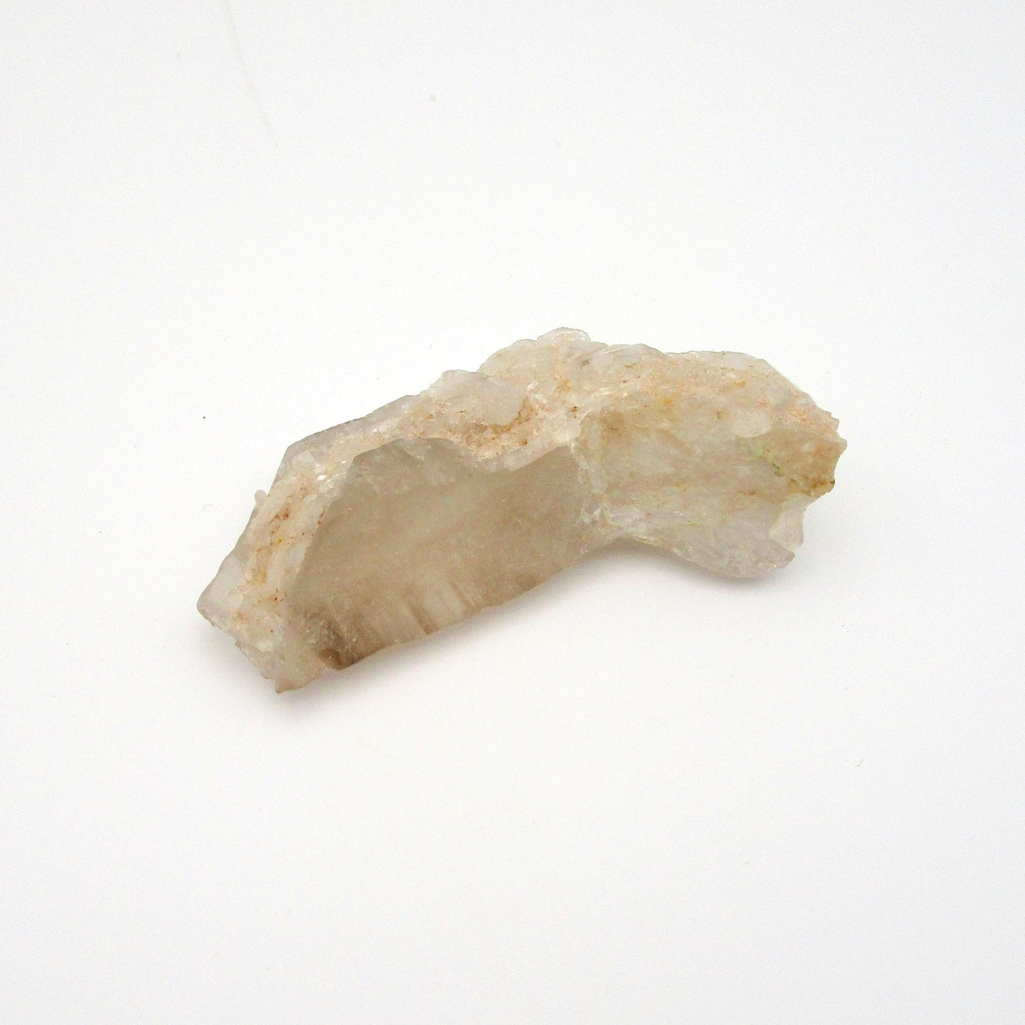 A rough, uncut Russian Quartz crystal point against a white background.